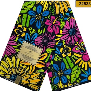 May include: A black fabric with a colourful floral print. The fabric features a variety of flowers in shades of pink, yellow, blue, and green. The fabric is printed with the text "Unique Fashion" in white.
