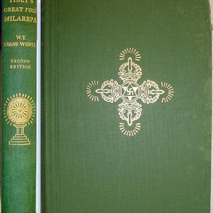 May include: A hardcover book titled "Tibet's Great Yogi Milarepa" by W.Y. Evans-Wentz. The book has a green cover with gold lettering and a decorative emblem. The spine also features text and a gold design. Published by Oxford.