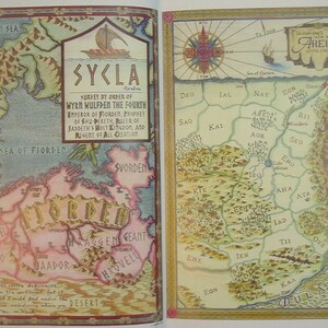 May include: A hand-drawn map of the fictional land of Sycla, with the title "Sycla" in gold lettering. The map is divided into regions with names like "Fjorden", "Sworden", and "Hrovelli". The map is surrounded by a decorative border.