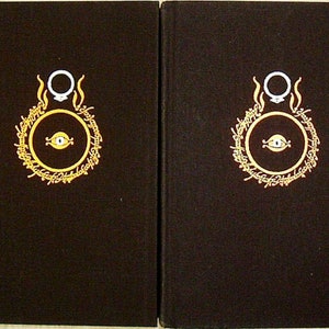 May include: A set of five hardback books with black covers and gold lettering. The books are titled "The Fellowship of the Ring", "The Two Towers", "The Return of the King", and "The Hobbit".