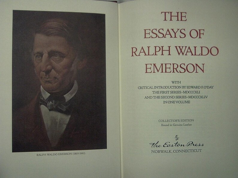 May include: An open book featuring a portrait of Ralph Waldo Emerson on the left page and the title "The Essays of Ralph Waldo Emerson" on the right. The book is a collector's edition bound in genuine leather.