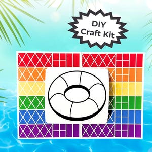 May include: DIY craft kit featuring a black and white outline of a pool float. The float is surrounded by a colourful grid of squares and diamonds.