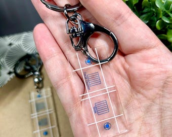 Llavero acrílico impreso con contador de heces - 2"