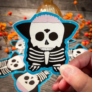 90s Nostalgia Halloween Sticker: Animatronic Skeleton Toy