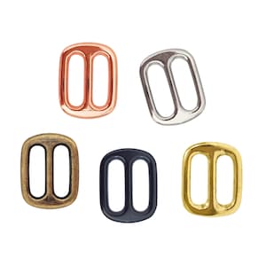 May include: A trio of ceramic mugs with a speckled, matte finish in cream, light grey, and dark grey. Each mug features a minimalist design and a rounded handle. Ideal for tea or coffee.