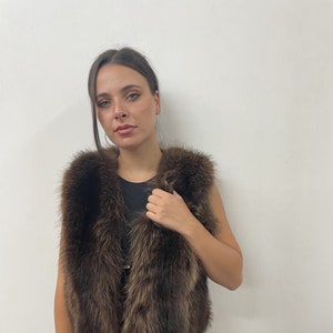 Racoonn fur vest ,brown color ,full skin pelt fluffy and warm winter garment womans gift