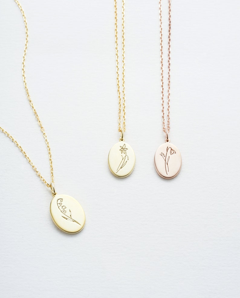 a handmade simple silver necklace with engraved birth flower on the pendant if the most meaningful gift for mom