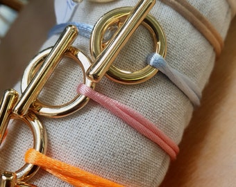 Cord bracelet with golden Toggle clasp