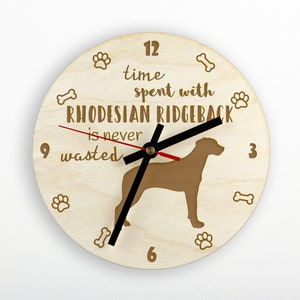 May include: A wooden clock with a brown Rhodesian Ridgeback silhouette and the text "Time spent with Rhodesian Ridgeback is never wasted".