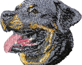 May include: Embroidered patch featuring a Rottweiler dog's head. The patch showcases detailed stitching in shades of gray, black, and gold, with a pink tongue. The dog's head is in profile, with its tongue sticking out.