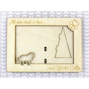 May include: Wooden frame with the text "All you need is love... and Border Collie". The frame has a cut-out of a Border Collie dog and a Christmas tree.
