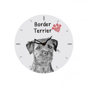 Może przedstawiać: Biały, okrągły zegar z czarnymi wskazówkami i czarno-białym obrazkiem Border Terriera. Tarcza zegara zawiera również napis "Border Terrier" i czerwoną łapę z sercem.