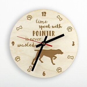 May include: A wooden clock with a brown pointer silhouette and the text "Time spent with Pointer is never wasted". The clock face has black hands and a red second hand.