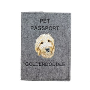 May include: Grey felt pet passport holder with embroidered golden doodle dog and the text "PET PASSPORT" and "GOLDENDOODLE".