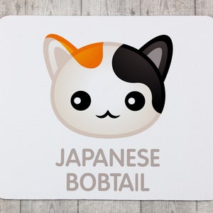 A computer mouse pad with a geometric cat, Japanese bobtail. Mousepad, Mousemat, coworker office gift, desk accessories