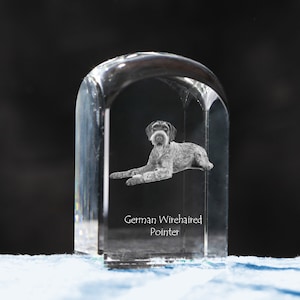 May include: A clear glass paperweight with a 3D etched image of a German Wirehaired Pointer dog. The text "German Wirehaired Pointer" is engraved below the image.