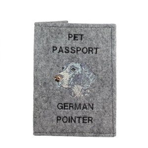 May include: Grey felt pet passport holder with an embroidered German Pointer dog and the text "PET PASSPORT GERMAN POINTER".