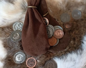 Medieval coin purse with double compartment and two brass rings.