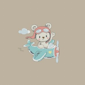 May include: A white teddy bear wearing a red pilot's hat and goggles flies a blue aeroplane with a yellow heart on the side. The aeroplane has a propeller and a cloud behind it.