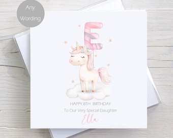 May include: A white unicorn with a pink horn and a pink flower crown holds a pink letter E balloon. The unicorn is standing on a white cloud with gold stars. The text reads "Happy 8th Birthday To Our Very Special Daughter Ella".