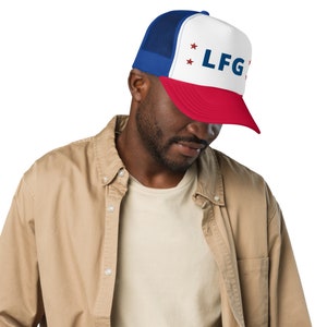 May include: A blue, white, and red trucker hat with a mesh back. The hat has red stars and the text "LGF" on the front.