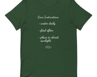 Pflanzen Pflegehinweise T-Shirt: Gartenarbeit Grüner Daumen Unisex T-Shirt
