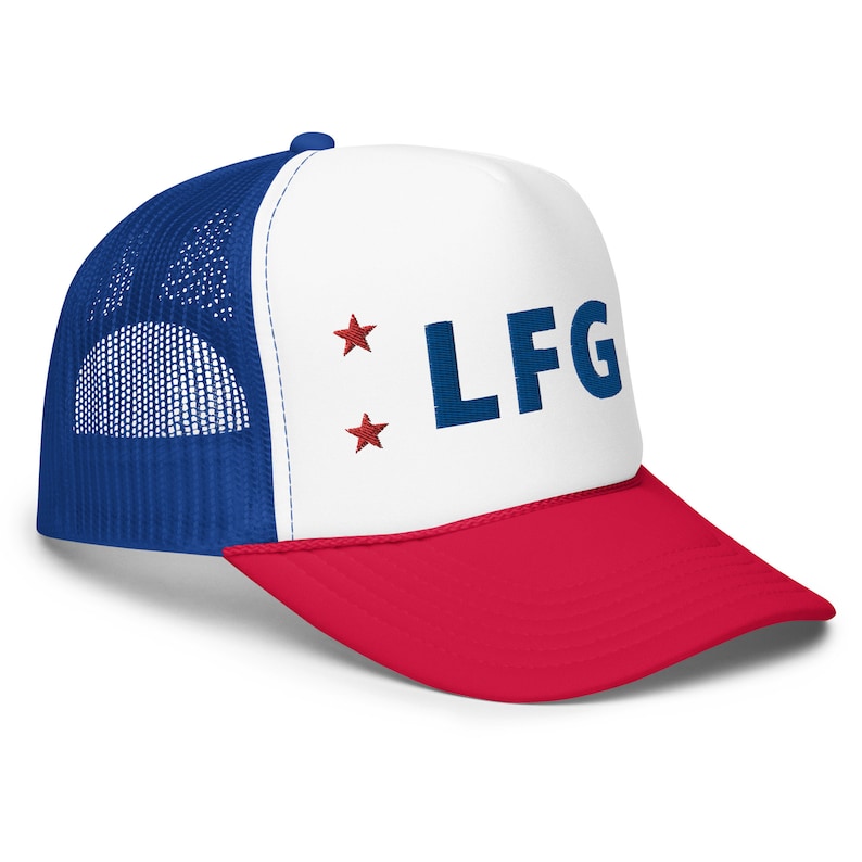 May include: A white, blue, and red trucker hat with a blue "LF G" embroidered on the front. Two red stars are on either side of the text.