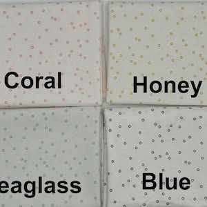 May include: Four fabric swatches with white backgrounds and different colored dots. The swatches are labeled "Coral", "Honey", "Seaglass", and "Blue".