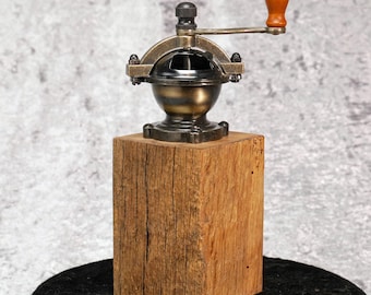 Retro-style spice mill on old oak for pepper and salt