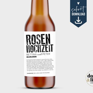 May include: A brown glass bottle with a white rectangular label featuring the black text ROSEN HOCHZEIT, BETTINA und PETER, and the date 22.09.2025. The label includes a paragraph of German text and the word SYNONYME followed by text.