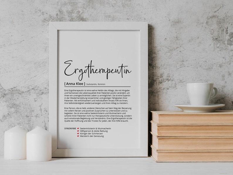 May include: A black and white printable art print with the German word "Ergotherapentin" and the definition of an occupational therapist in German. The print also includes the name "Anna Klee" and the word "Substantiv feminin".