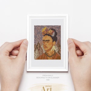 May include: A PDF pattern for cross stitching a portrait of Frida Kahlo, titled "Frida Kahlo Dedicated to Dr Eloesser 1940". The pattern is part of a "mini Art Cross Stitch Collection".