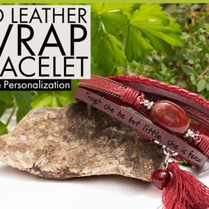 May include: Red leather wrap bracelet with a red stone charm and a tassel. The bracelet has the inscription "Though she be but little, she is fierce!"
