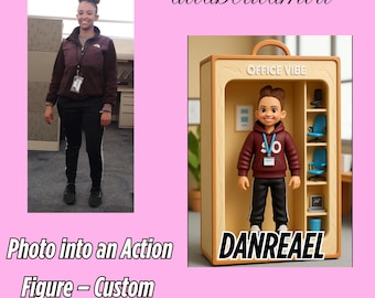 May include: The image shows a custom action figure in a display case next to a photo of a person. The action figure is wearing a maroon hoodie and black pants. The display case has the words "OFFICE VIBE" and "DANREAEAL" on it. The photo is of a person wearing a maroon jacket and black pants.