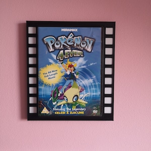 May include: A black framed DVD case with a filmstrip border. The case features a colourful image of Pokemon characters Celebi and Suicune from the movie "Pokemon 4Ever". The text "MIRAMAX" and "Pokemon 4Ever" are visible on the case.