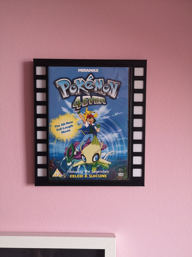 May include: A black framed DVD case with a filmstrip border. The case features a colourful image of Pokemon characters Celebi and Suicune from the movie "Pokemon 4Ever". The text "MIRAMAX" and "Pokemon 4Ever" are visible on the case.