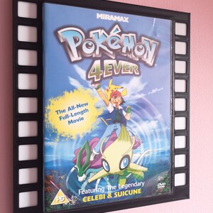 May include: A black DVD case with a filmstrip border. The case features a colourful illustration of Pokemon characters, including Celebi and Suicune. The title of the movie is "Pokemon 4Ever".