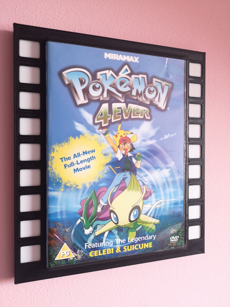 May include: A black DVD case with a filmstrip border. The case features a colourful illustration of Pokemon characters, including Celebi and Suicune. The title of the movie is "Pokemon 4Ever".