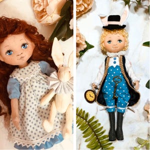 May include: Two handmade cloth dolls, one with red hair and a blue dress, the other with blonde hair and a blue polka dot outfit. The doll on the right has a black hat with bunny ears and a pocket watch.
