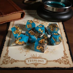 Oracle's Lagoon Dice Set - Sharp Edge Polyhedral RPG Dice with Gold & Copper Foil Inclusions
