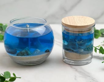 Handmade nautical blue gel candle with cotton wick and with sand and shells with beach bum scent
