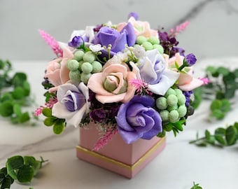 Handmade purple, pink, green soap bouquet of roses and brunia soaps and with ocean roses fragrance oil and jojoba oil in the clear gift wrap
