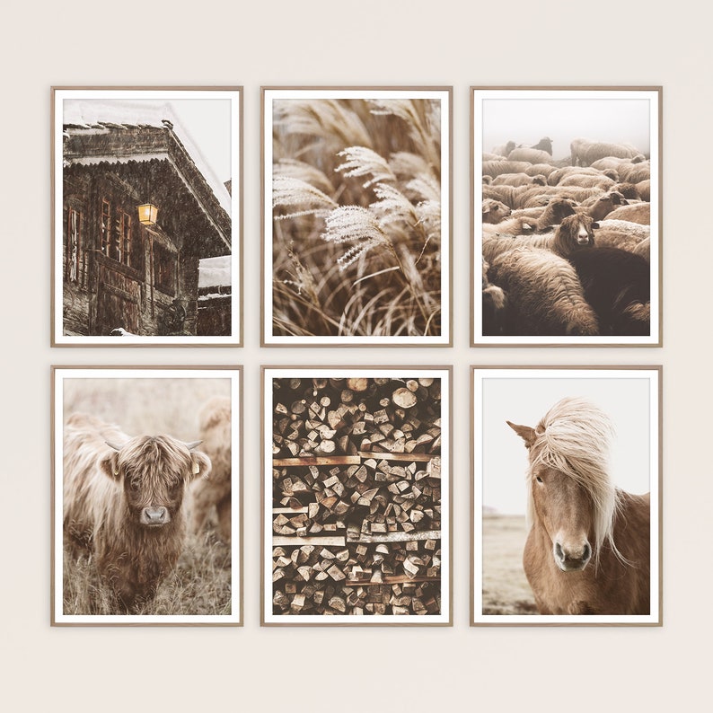 May include: Six framed prints with nature-themed images. The prints feature a snowy cabin, tall grass, a herd of sheep, a Highland cow, stacked firewood, and a horse with a long mane. Each image has a neutral color palette.