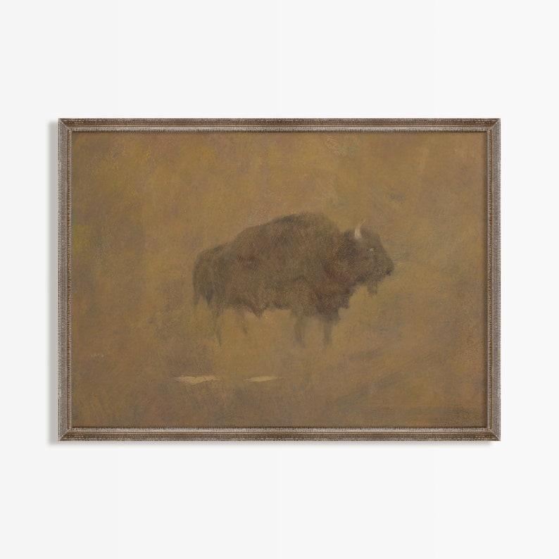 K&ouml;nnte beinhalten: Ein gerahmtes Gem&auml;lde eines braunen Bisons, der auf einem Feld steht. Der Hintergrund ist in einem ged&auml;mpften Braunton gehalten, und der Bison ist vor ihm silhouettiert.