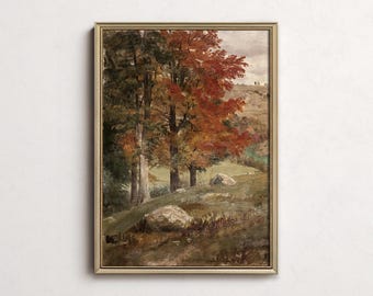 May include: A framed landscape painting depicts a forest scene with trees in autumn colors. The artwork features a path, rocks, and a distant hill under a cloudy sky. The frame is gold-toned.