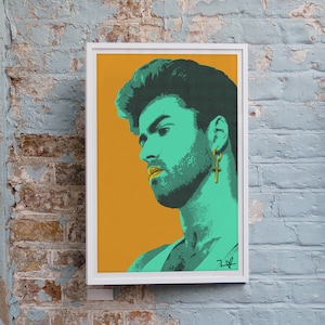 May include: Three framed pop art prints displayed against a weathered brick wall. The prints feature stylized portraits in vibrant colors: a teal and orange portrait of a man, a purple and yellow portrait of a woman, and a portrait of a person in purple and brown.