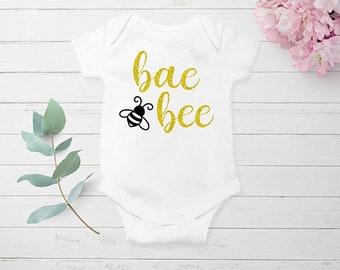 baby clothes with bees on them