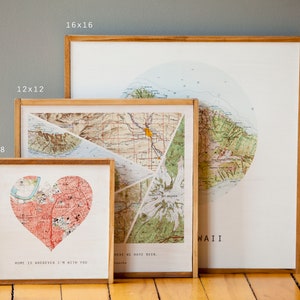 May include: Three framed maps of Hawaii, with different sizes and designs. The smallest map is a heart-shaped design with the text "Home is wherever I'm with you". The middle map is a collage of different map sections with the text "Here we have been". The largest map is a circular design with the text "Hawaii".