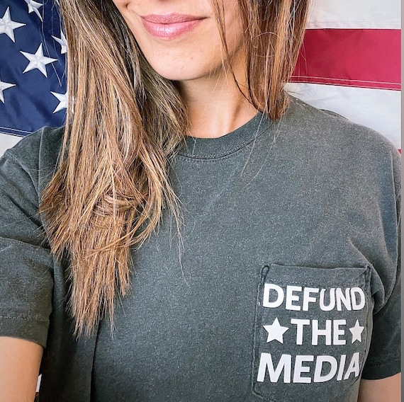 Defund The Media loose fit white washed unisex pocket tee 100% cotton