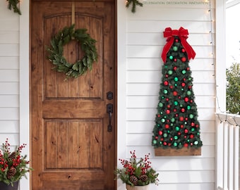 May include: A wall-mounted artificial Christmas tree decoration featuring green pine needles, red and green ornaments, and a large red velvet bow at the top. The tree is mounted on a rectangular wooden base and displayed on a white exterior wall.
